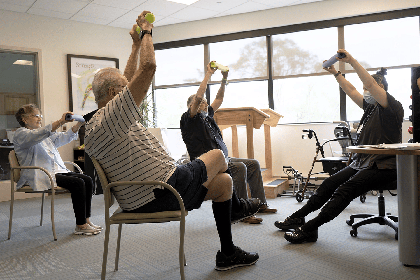 Woman running exercise class at the TLC facility