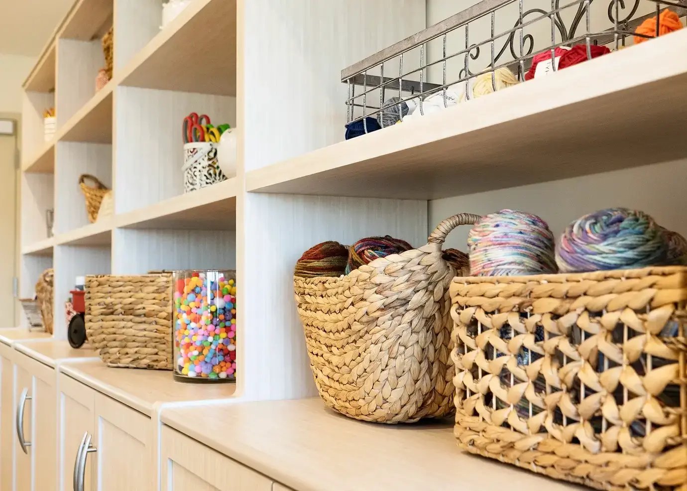Shelves with various arts and crafts materials on them